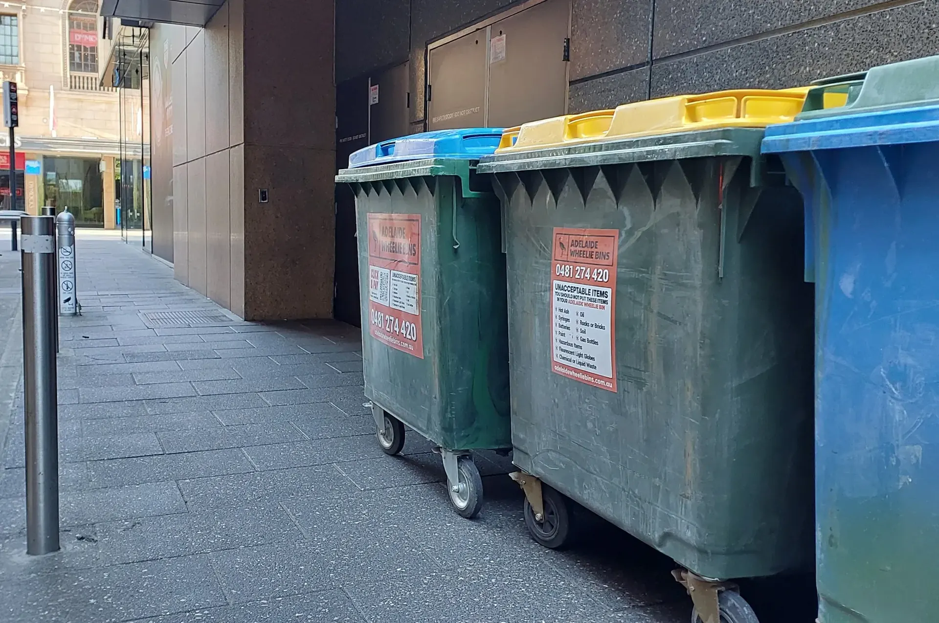 Commercial wheelie bins waiting for collection outside an Adelaide CBD building